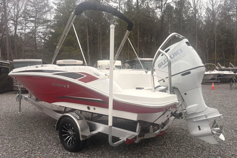 Slide: The Image of 2023 Hurricane SunDeck Sport 205 OB boat with Suzuki outboard motor on trailer. - 16