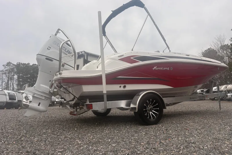 Slide: The Image of 2023 Hurricane SunDeck Sport 205 OB boat with Suzuki outboard motor on trailer. - 18