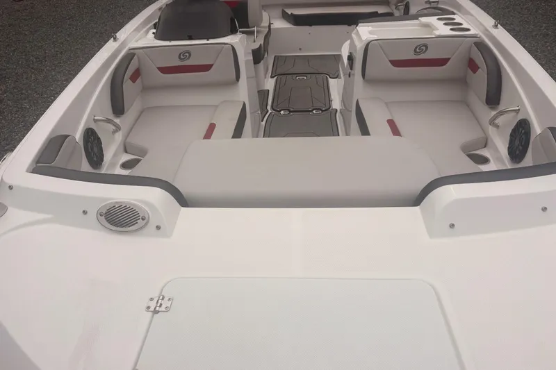 Slide: The Image of 2023 Hurricane SunDeck Sport 205 OB boat interior with seating and speakers. - 20