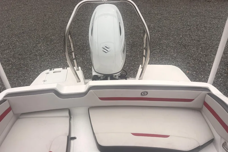 Slide: The Image of 2023 Hurricane SunDeck Sport 205 OB boat interior with Suzuki outboard motor. - 21