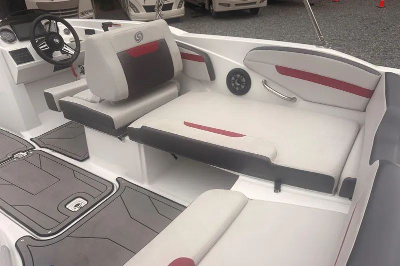Slide: The Image of 2023 Hurricane SunDeck Sport 205 OB interior with seating and steering wheel. - 22