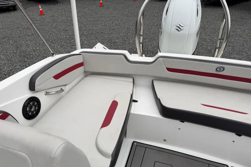 Slide: The Image of 2023 Hurricane SunDeck Sport 205 OB boat interior with seating and motor. - 29