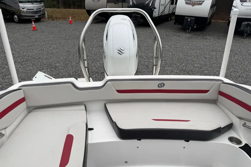 Slide: The Image of 2023 Hurricane SunDeck Sport 205 OB boat interior with Suzuki outboard motor. - 31