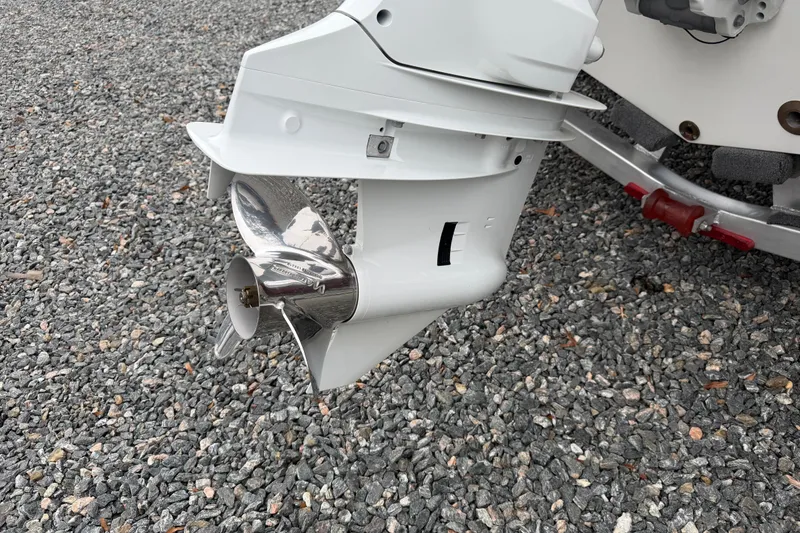 Slide: The Image of 2023 Hurricane SunDeck Sport 205 OB outboard motor on gravel surface. - 33
