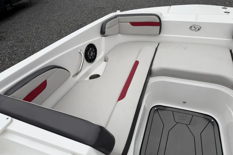 Slide: The Image of 2023 Hurricane SunDeck Sport 205 OB boat interior with cushioned seating and speaker. - 36