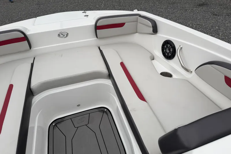Slide: The Image of 2023 Hurricane SunDeck Sport 205 OB boat interior with cushioned seating and speaker. - 37