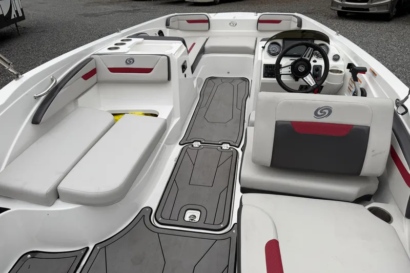 Slide: The Image of 2023 Hurricane SunDeck Sport 205 OB boat interior with modern seating and steering console. - 8