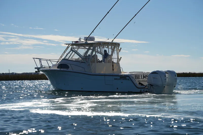 Slide: The Image of 2023 Grady-White Marlin 300 boat cruising on a sunny day. - 0