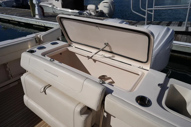 Slide: The Image of 2023 Grady-White Marlin 300 boat with open storage compartment at dock. - 29
