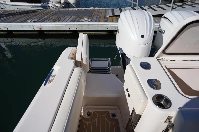 Slide: The Image of 2023 Grady-White Marlin 300 boat stern with twin engines at dock. - 31