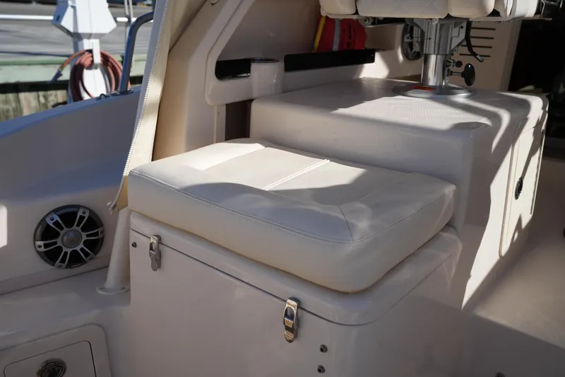 Slide: The Image of 2023 Grady-White Marlin 300 boat interior seating with storage compartment. - 37
