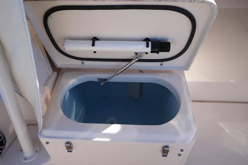 Slide: The Image of Livewell compartment on 2023 Grady-White Marlin 300 boat, open lid view. - 38
