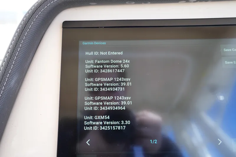 Slide: The Image of Garmin device screen on 2023 Grady-White Marlin 300 boat displaying software versions. - 42