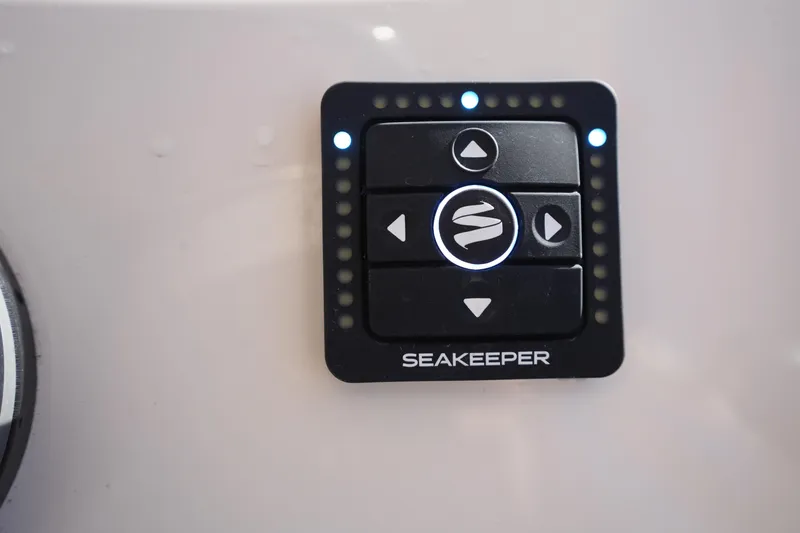 Slide: The Image of Control panel of a 2023 Grady-White Marlin 300 boat with Seakeeper stabilization system. - 46