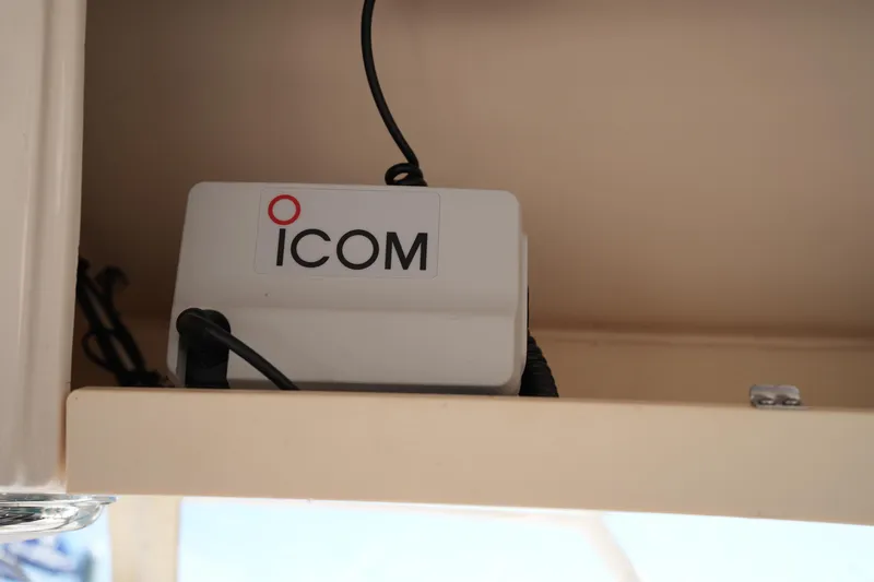 Slide: The Image of ICOM device installed on 2023 Grady-White Marlin 300 boat shelf. - 52