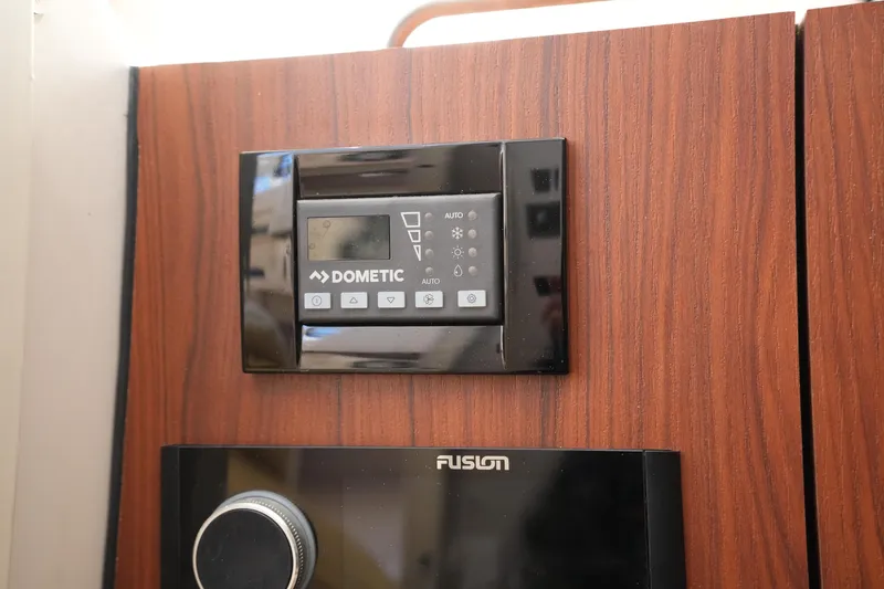 Slide: The Image of Dometic control panel on 2023 Grady-White Marlin 300 boat interior. - 60