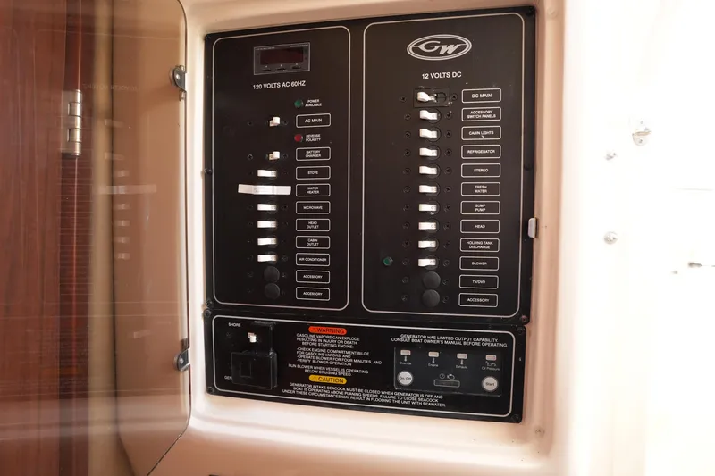 Slide: The Image of Electrical control panel on a 2023 Grady-White Marlin 300 boat. - 61