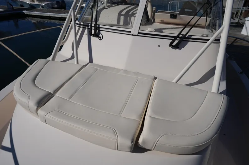 Slide: The Image of 2023 Grady-White Marlin 300 boat with cushioned seating on deck. - 63