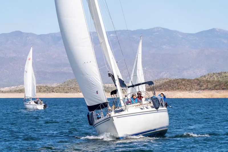 Slide: The Image of 1989 Catalina 36 sailboat navigating open waters. - 0