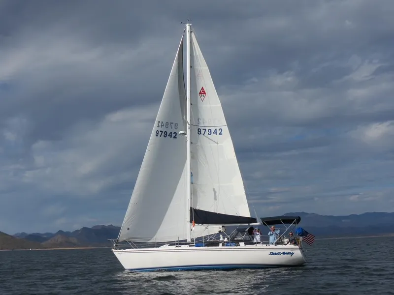 Slide: The Image of 1989 Catalina 36 sailboat on calm waters. - 1