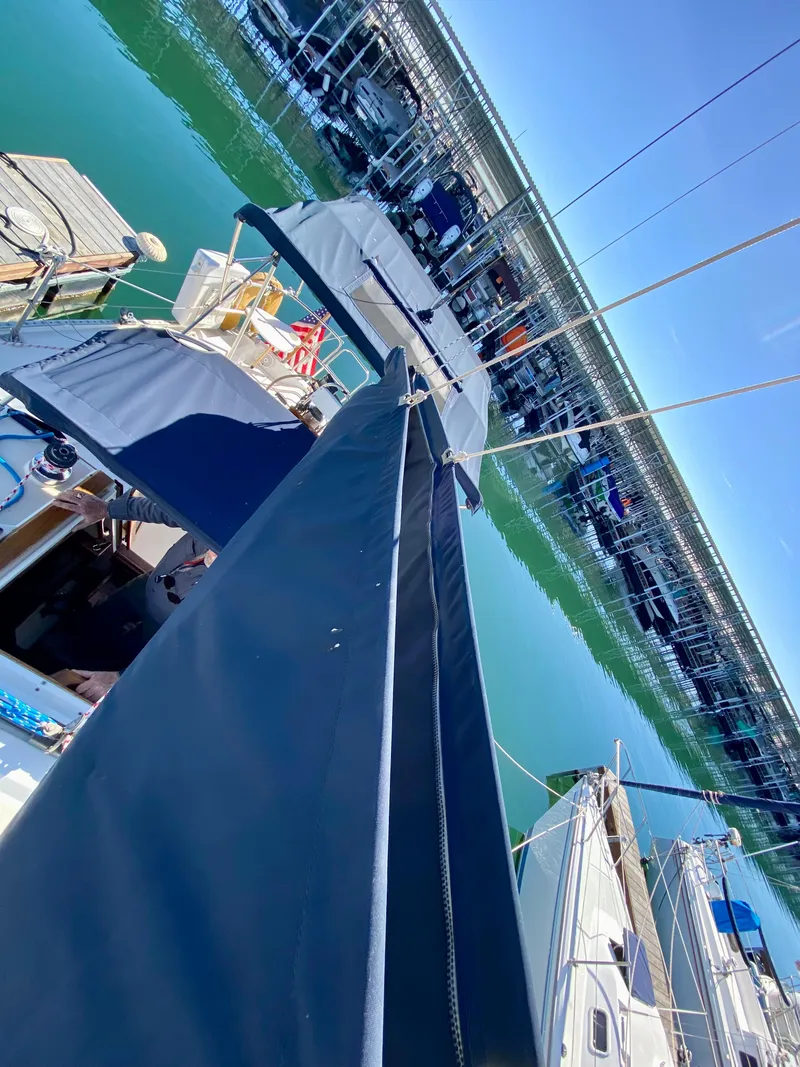 Slide: The Image of 1989 Catalina 36 sailboat docked in marina. - 34