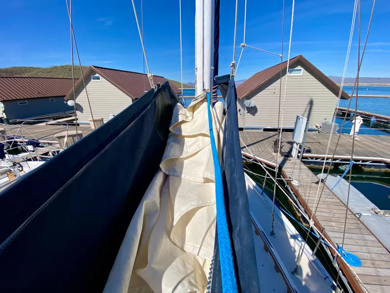 Slide: The Image of 1989 Catalina 36 sailboat docked, with folded sail. - 35