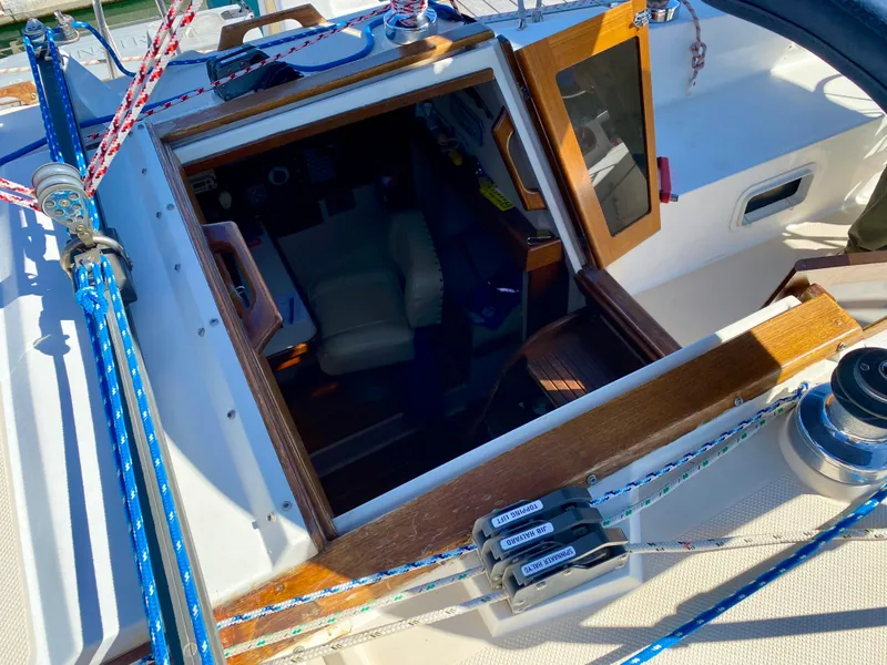 Slide: The Image of Interior view of a 1989 Catalina 36 yacht with cockpit and controls. - 38