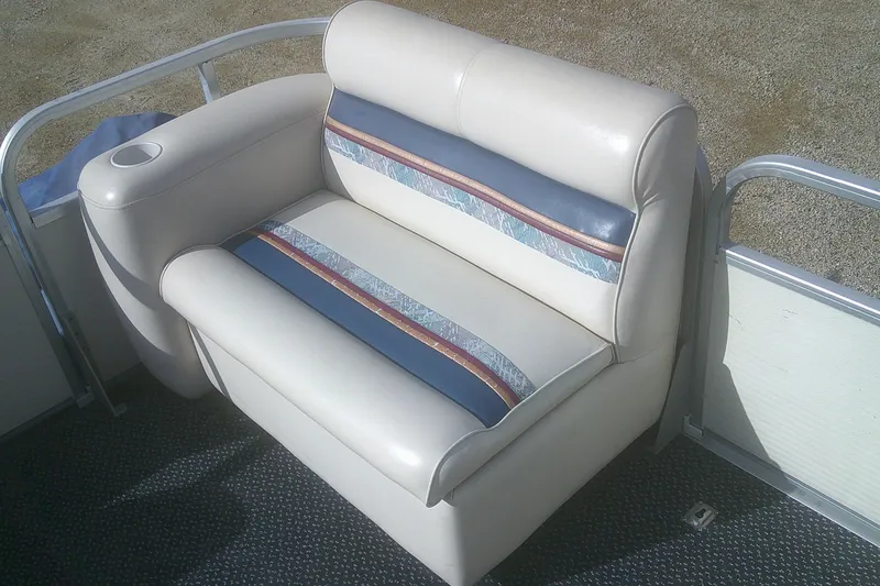 Slide: The Image of Premier 210 Sunsation 1998 boat seat with blue and beige upholstery, cup holder included. - 13