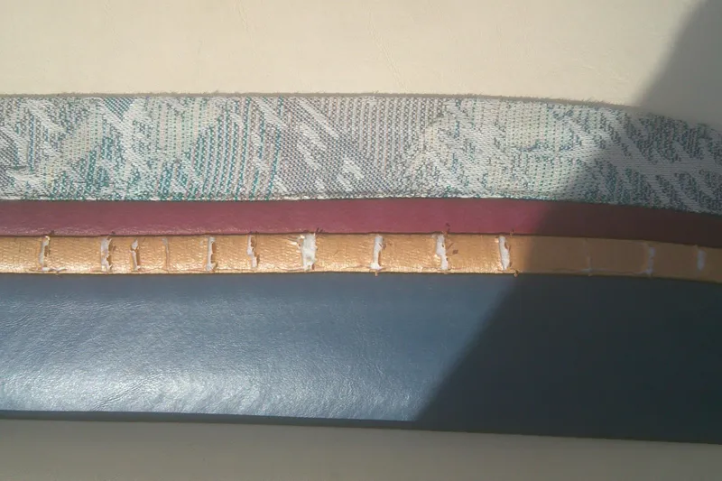 Slide: The Image of Worn upholstery detail of a 1998 Premier 210 Sunsation boat seat. - 14