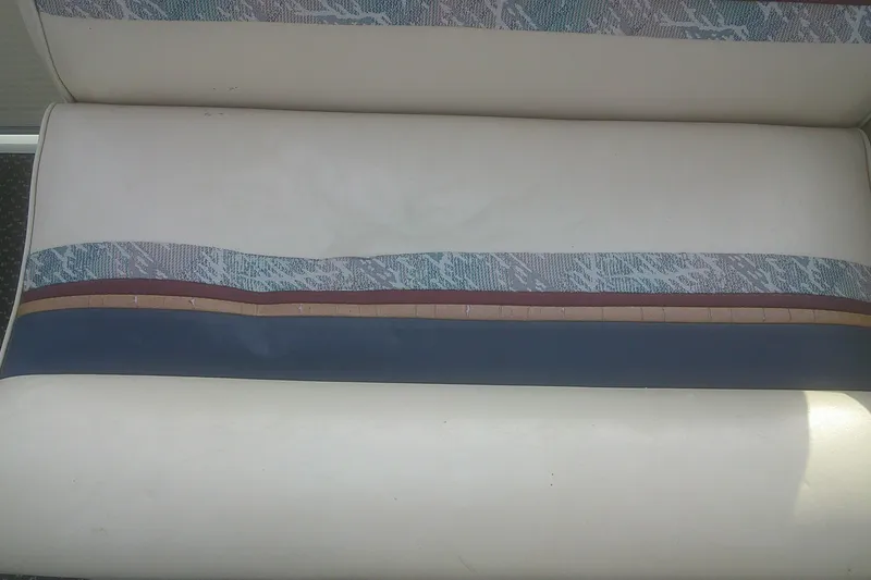 Slide: The Image of 1998 Premier 210 Sunsation boat seat with multicolored upholstery design. - 15