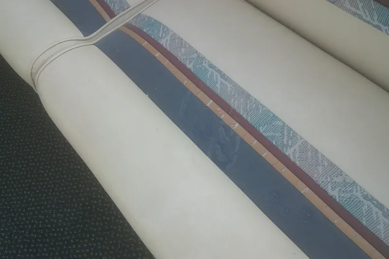 Slide: The Image of 1998 Premier 210 Sunsation boat seat with patterned upholstery and textured design. - 16