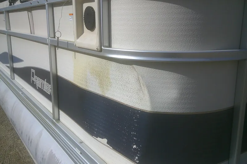 Slide: The Image of 1998 Premier 210 Sunsation pontoon boat with visible exterior wear and discoloration. - 20