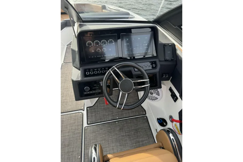 Slide: The Image of 2022 Cobalt R4 Surf boat dashboard with modern controls and steering wheel. - 18