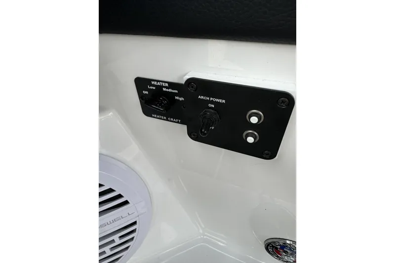 Slide: The Image of Control panel of 2022 Cobalt R4 Surf boat with heater and arch power switches. - 20