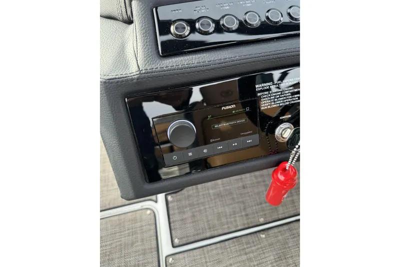 Slide: The Image of 2022 Cobalt R4 Surf dashboard with Fusion audio system and ignition keys. - 23