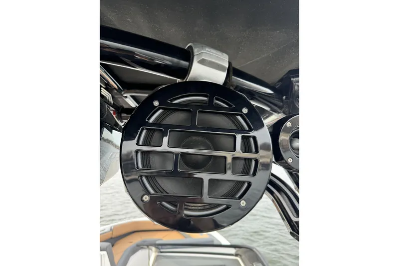 Slide: The Image of Close-up of a black speaker on a 2022 Cobalt R4 Surf boat. - 24