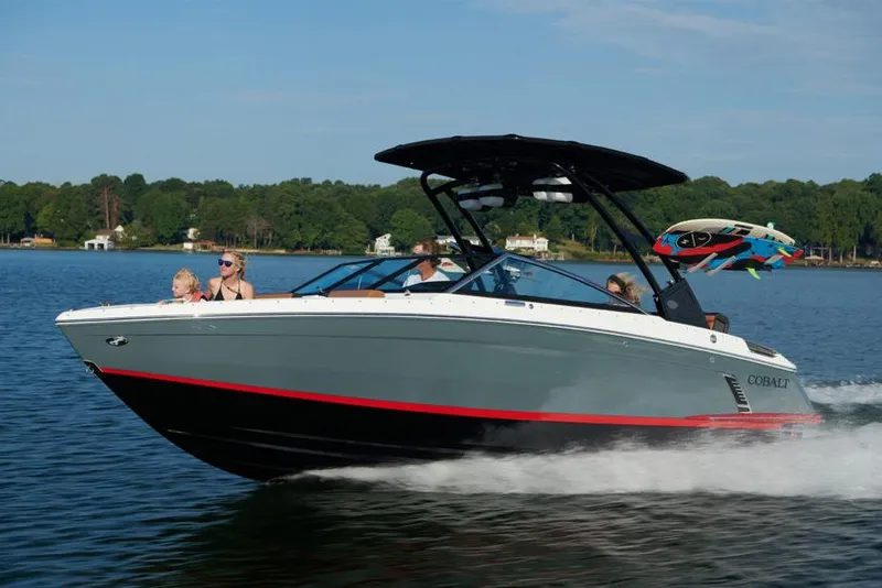 Slide: The Image of Manufacturer Provided Image: 2022 Cobalt R4 Surf boat cruising on a lake with passengers. - 28