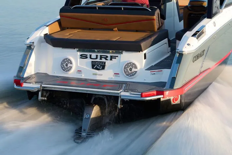 Slide: The Image of Manufacturer Provided Image: 2022 Cobalt R4 Surf boat rear view in motion on water. - 31