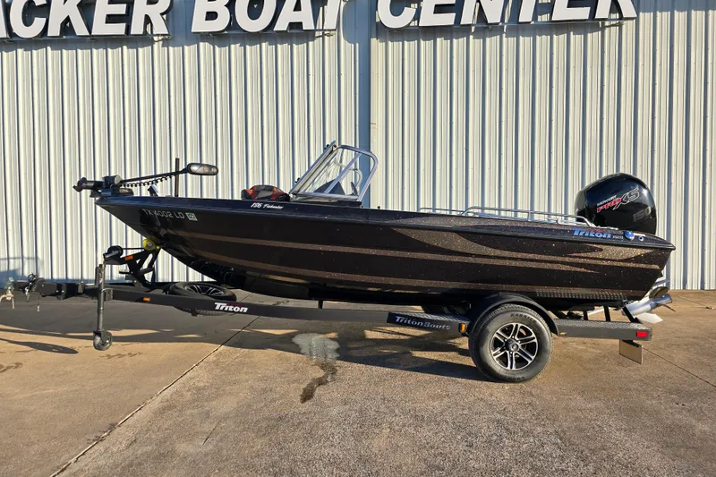 Slide: The Image of 2022 Triton 186 Fishunter boat on trailer outside Tracker Boat Center. - 2