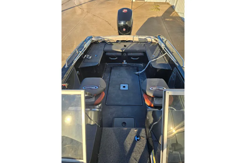 Slide: The Image of 2022 Triton 186 Fishunter boat interior with seating and storage compartments. - 3
