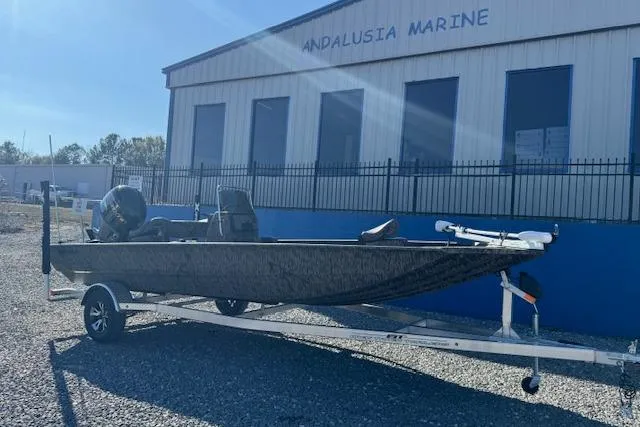 Slide: The Image of 2026 Xpress XP20CC boat on trailer outside Andalusia Marine building. - 1