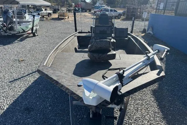 Slide: The Image of 2026 Xpress XP20CC boat on gravel lot, featuring a trolling motor and spacious deck. - 12