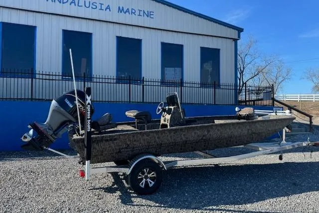 Slide: The Image of 2026 Xpress XP20CC boat on trailer outside Andalusia Marine building. - 2