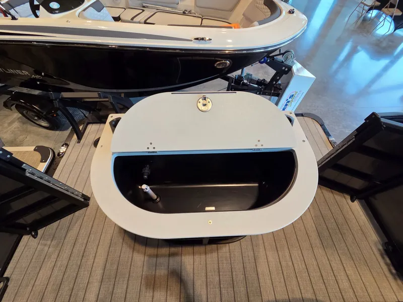 Slide: The Image of 2026 Bentley Pontoons FISH 200 interior view with storage compartment. - 19