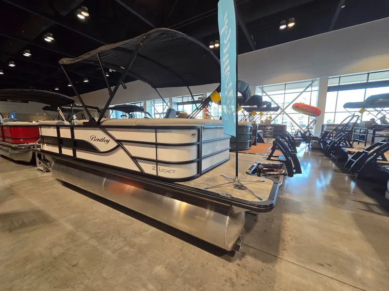 Slide: The Image of 2026 Bentley Pontoons Legacy 200 Cruise XL in showroom. - 3