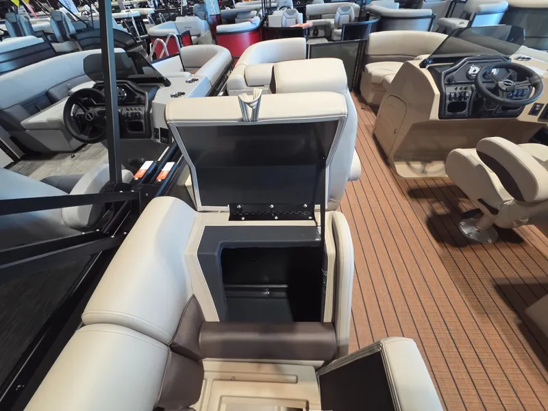 Slide: The Image of Interior of 2026 Bentley Pontoons Legacy 200 Navigator with storage compartment. - 17