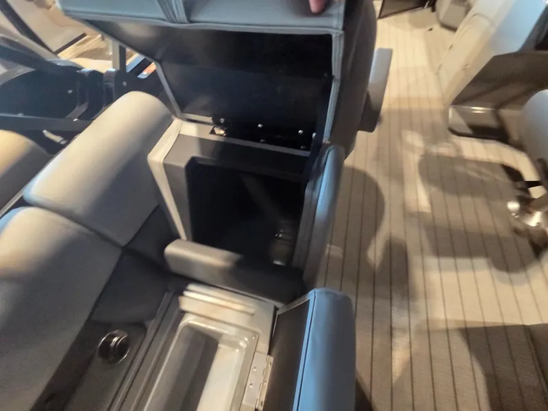 Slide: The Image of Interior of 2026 Bentley Pontoons Legacy 220 Navigator with storage compartment. - 22