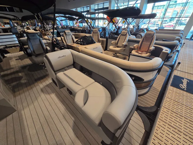 Slide: The Image of 2026 Bentley Pontoons Legacy 220 Navigator in showroom. - 5