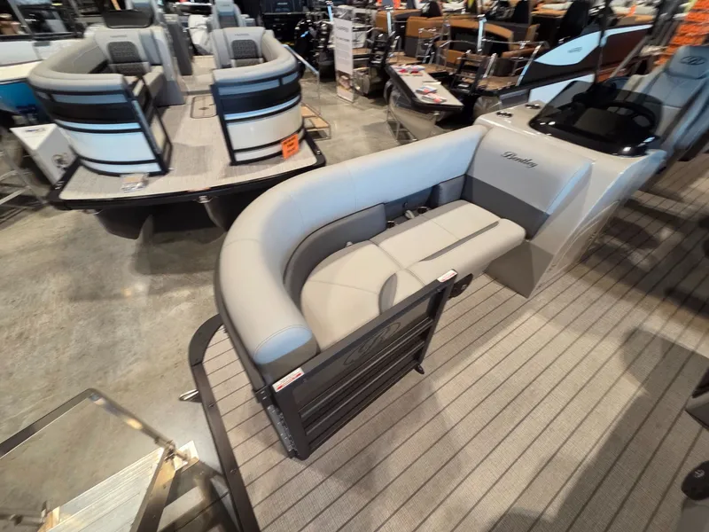 Slide: The Image of 2026 Bentley Pontoons Legacy 220 Navigator in showroom. - 6