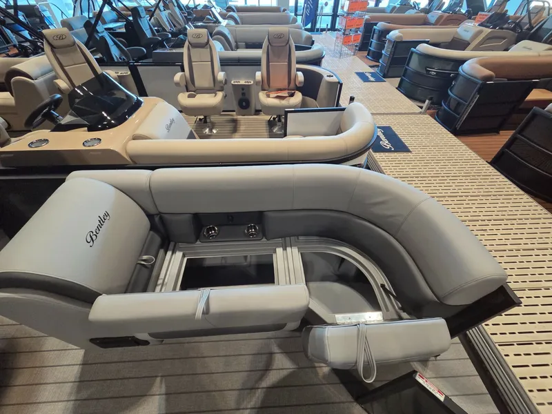 Slide: The Image of 2026 Bentley Pontoons Legacy 220 Navigator in showroom. - 8